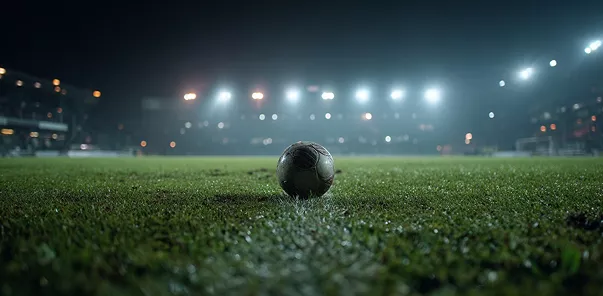 1xBet logo with football on stadium pitch